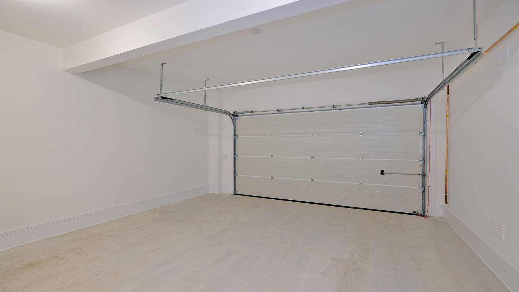 Spacious garage with folding electric door 