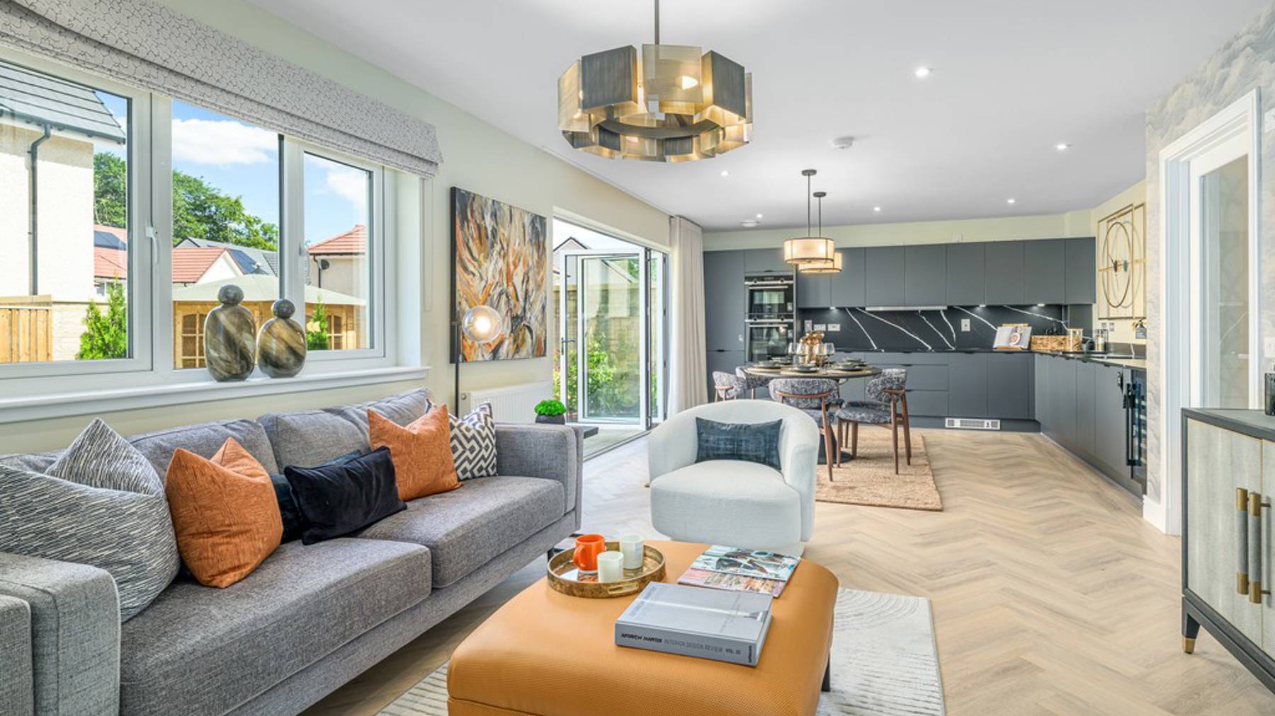 5 bedroom showhome | impressive high spec kitchen, dining and lounge area with bi-fold doors to the garden