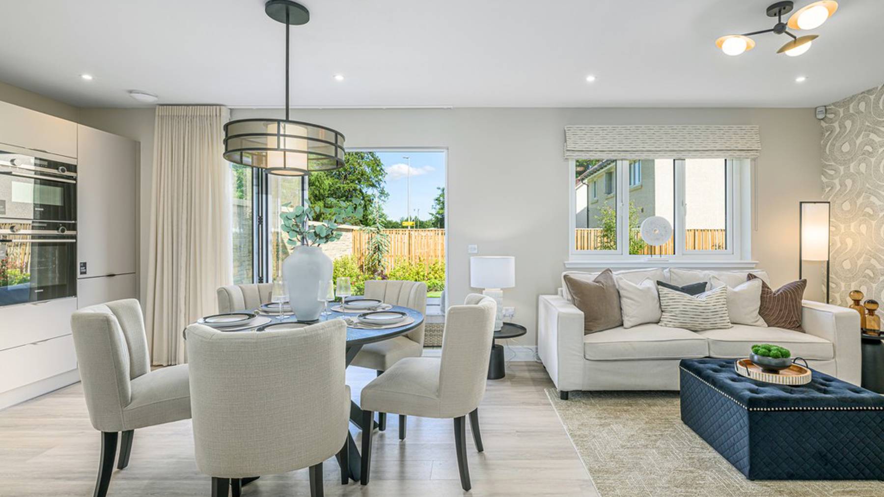 4 bedroom plus study showhome | open plan high spec kitchen and dining area with bi-fold doors to the garden