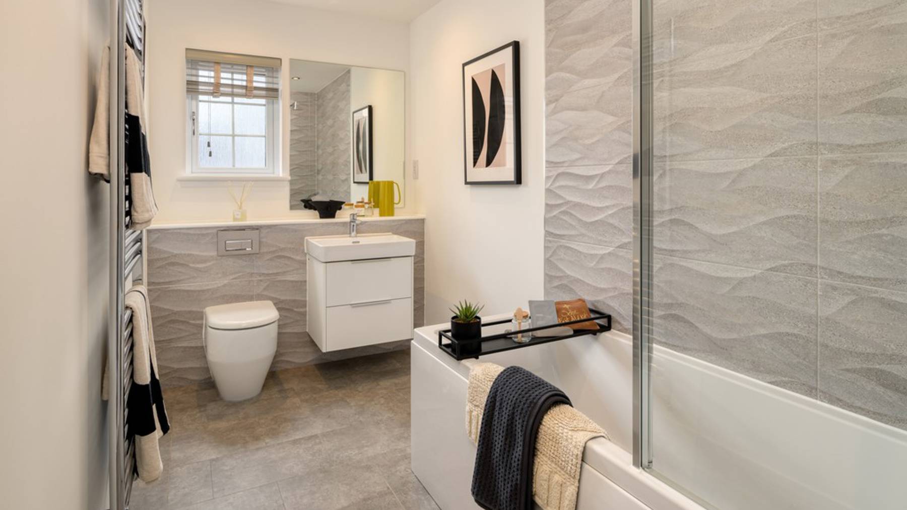 3 bedroom showhome | stylish family bathroom with sleek fittings and shower/bath with full-height tiling