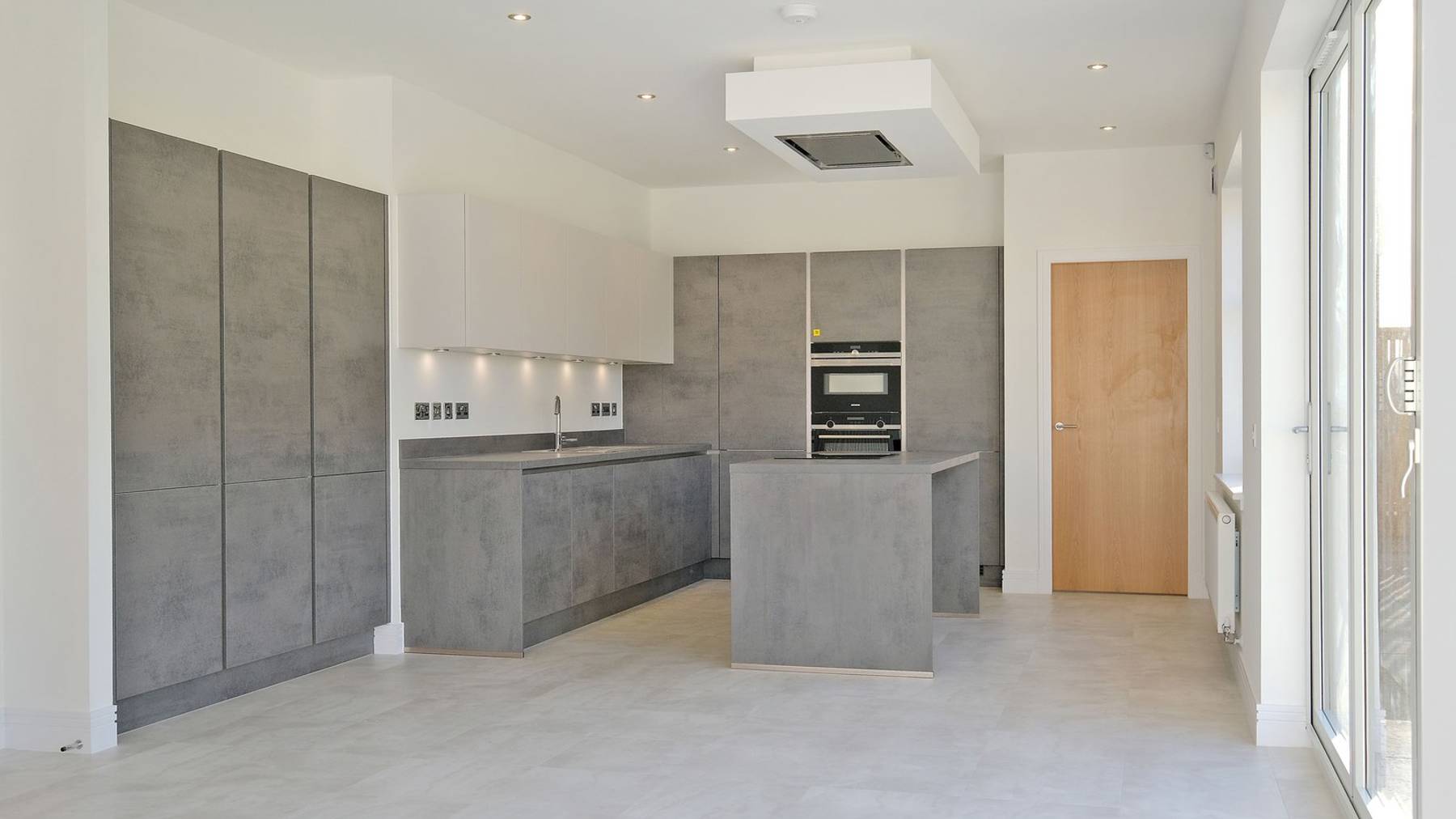 Image of the large and spacious grey kitchen 