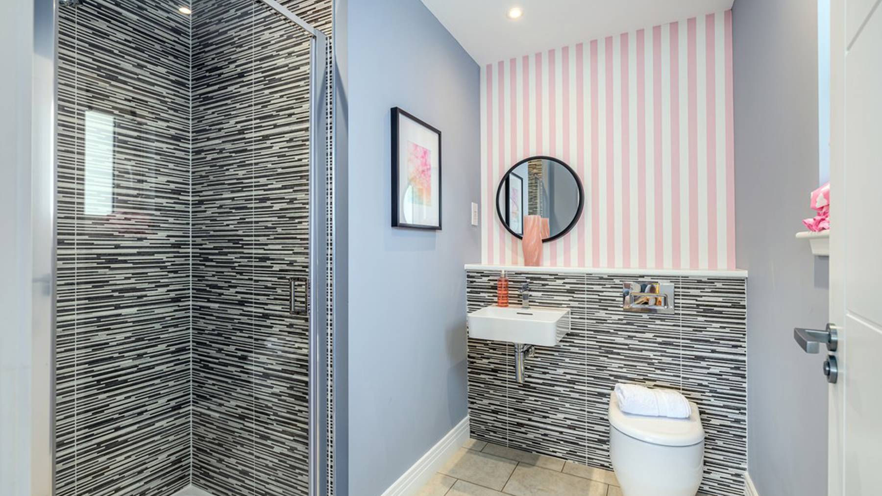 4 bedroom showhome | sleek en suites with chrome fittings and full-height tiling