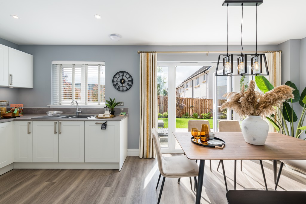 4 bedroom showhome | Open plan high spec kitchen and dining area with bi-fold doors to the garden
